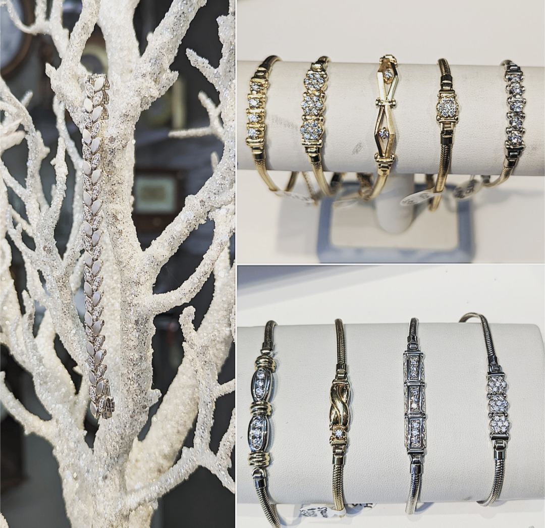 A sparkly diamond bracelet from Diekman's Jewelry hangs on a frosted white tree branch (left), while the right side shows gold and silver bracelets with diamond accents displayed on two white stands.