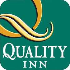 Quality Inn logo displays a stylized gold "Q" on a green background, with "Quality Inn" in bold white letters beneath the distinctive design.
