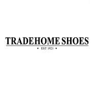 Black text logo reading "TRADEHOME SHOES" in capital letters, with a horizontal line above and below; beneath, "EST 1921" appears with a black dot on each side. Classic Tradehome Shoes branding on a white background.