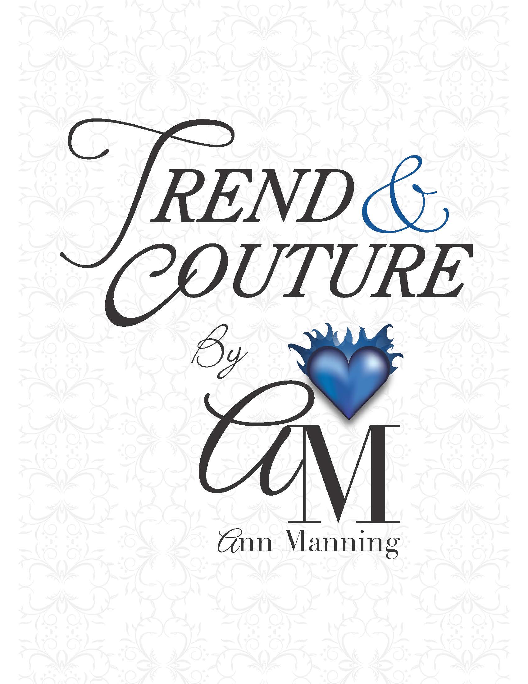 Text reads: "Trend & Couture by AM Ann Manning" in decorative fonts, with a blue heart and crown graphic above the "M". A pale floral pattern enhances the background, highlighting the elegance of Trend & Couture.