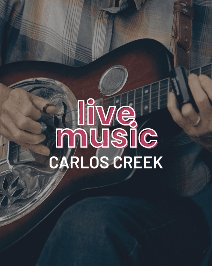 A person playing a resonator guitar in a plaid shirt. Text over the image reads, "live music CARLOS CREEK" with Friday night vibes at 22 Northmen Brewing.