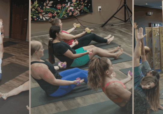 Three photos show a yoga class at Studio She Collective: people stretching on mats with arms raised, lifting small weights while seated, and standing in a side-stretch pose. The room features wood floors and colorful wall art.