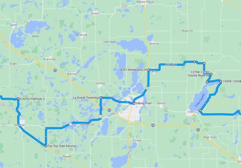 A digital map showing a blue driving route with multiple stops, starting near Barrett, passing through La Grand Township and along Viking Trail, and ending at Little Sauk, Minnesota. Various highways and water bodies are visible.