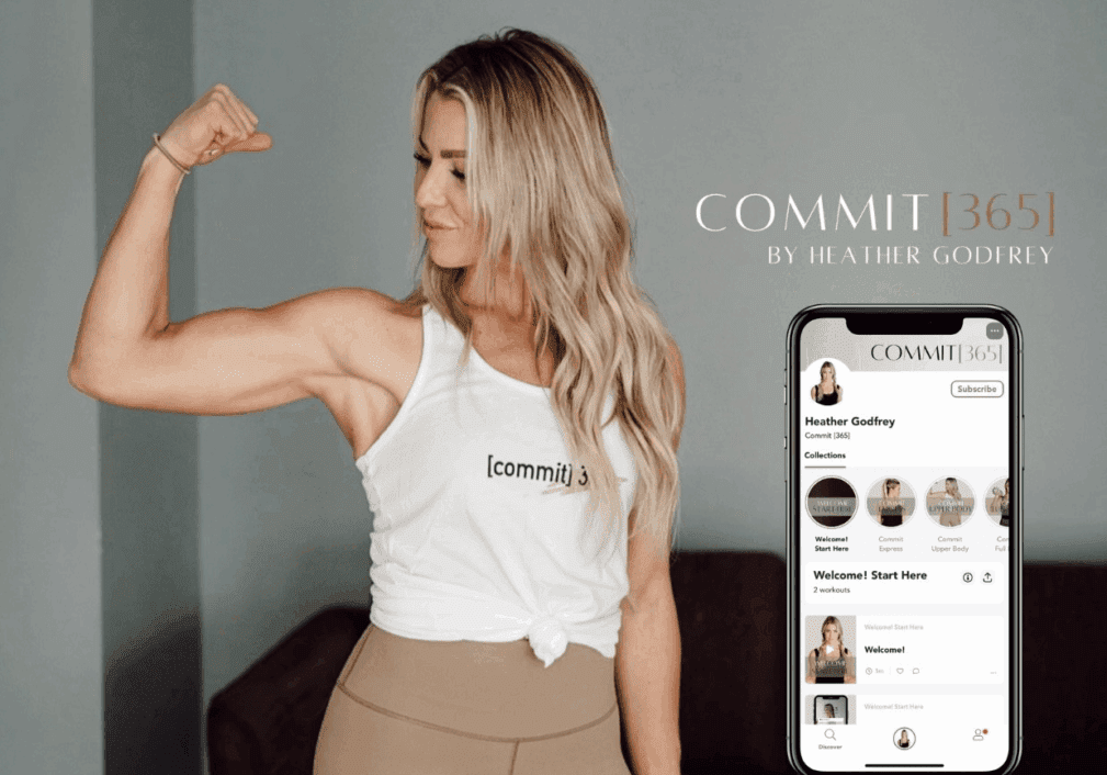 A fit woman in workout clothes flexes her arm and smiles. Next to her is a phone displaying the COMMIT[365] app by Heather Godfrey, with the app name and creator written beside it.